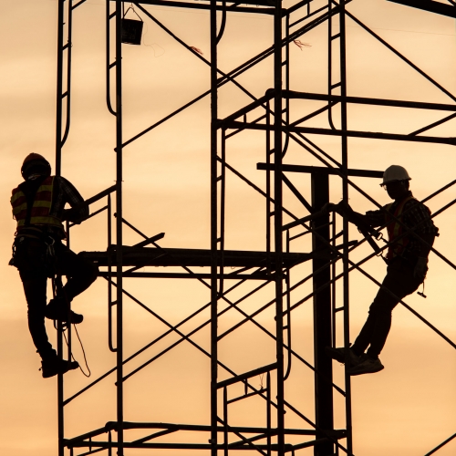 Silhouette Engineers Worker discussion with architects work planing in construction site working on high ground heavy industry and safety concept